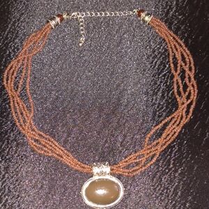 Elegant Multi Strand Brown Seed Bead Necklace with Silver and Brown Oval Pendant